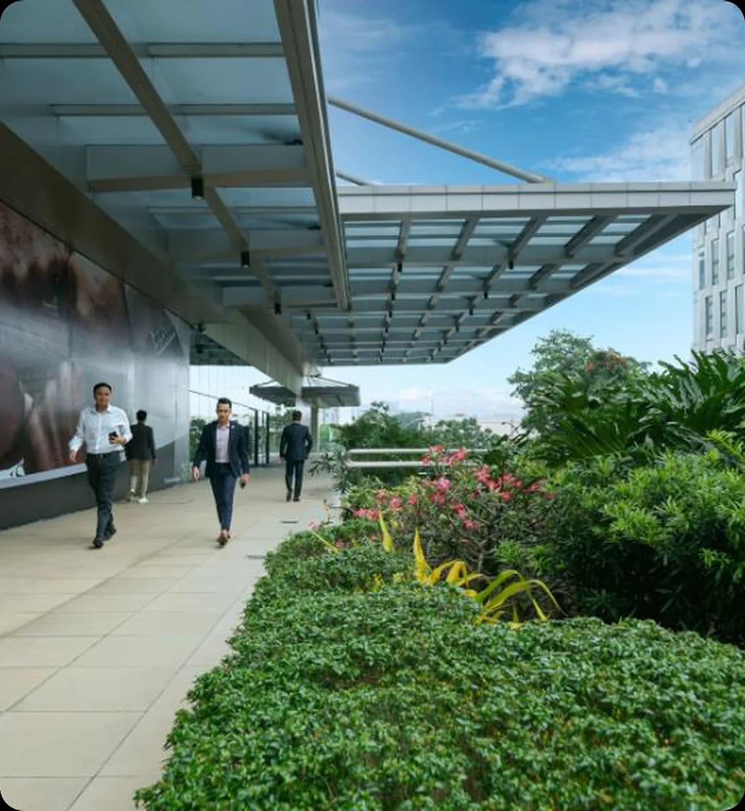 Business executives travelling along a modern airport corporate terminal corridor